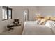 Bright bedroom features modern decor, comfortable seating area, and a large window with natural light at 15332 E Hidden Springs Trl, Fountain Hills, AZ 85268