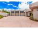 Wide driveway leading to a modern home featuring multiple garages and desert landscaping at 15332 E Hidden Springs Trl, Fountain Hills, AZ 85268