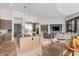 Open living space showcasing a modern kitchen, dining area, and living room with seamless flow and stylish design at 15332 E Hidden Springs Trl, Fountain Hills, AZ 85268