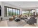 Bright living room featuring a comfortable seating area, floor to ceiling windows, and breathtaking outdoor views at 15332 E Hidden Springs Trl, Fountain Hills, AZ 85268