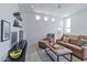 Bright living room features a comfortable sofa, chair and ottoman, with stylish decor at 15332 E Hidden Springs Trl, Fountain Hills, AZ 85268