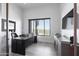 Modern office space with sleek desk, stylish cabinetry, and views of the desert landscape at 15332 E Hidden Springs Trl, Fountain Hills, AZ 85268