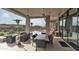 An upscale patio with a dining table, chairs, heaters, and an overlook to a pool with great scenery at 15332 E Hidden Springs Trl, Fountain Hills, AZ 85268