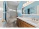 Bathroom featuring double sinks, modern fixtures, and a shower-tub combo at 162 W El Freda Rd, Tempe, AZ 85284