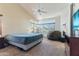 Spacious bedroom featuring a fan, large windows, and a comfortable beanbag chair at 162 W El Freda Rd, Tempe, AZ 85284