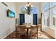 Bright dining room with a chandelier, large windows, and backyard views at 162 W El Freda Rd, Tempe, AZ 85284