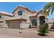 Two-story home featuring desert landscaping, a two-car garage, and a well-maintained yard at 162 W El Freda Rd, Tempe, AZ 85284