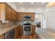 Modern kitchen with stainless steel oven and ample cabinet space, seamlessly connects to the living area at 162 W El Freda Rd, Tempe, AZ 85284