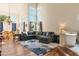 Bright living room with a large sectional sofa, area rug, and expansive windows for great light at 162 W El Freda Rd, Tempe, AZ 85284