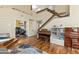 Open-concept living room featuring a staircase, office doorway, and hardwood floors throughout at 162 W El Freda Rd, Tempe, AZ 85284