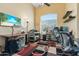 Functional home office space with a ceiling fan, large windows, and ample workspace at 162 W El Freda Rd, Tempe, AZ 85284