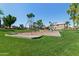 Neighborhood playground with swings, slides, and a rock-climbing structure, all set on a grassy lawn at 162 W El Freda Rd, Tempe, AZ 85284