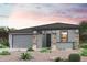 Charming single-story home featuring a two-car garage and desert landscaping for relaxed curb appeal at 17253 W Daley Ln, Surprise, AZ 85387