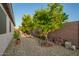 Paver path with lush trees and rock landscaping at 18001 N 44Th Way, Phoenix, AZ 85032
