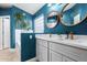 Stylish blue bathroom with double vanity and modern fixtures at 18001 N 44Th Way, Phoenix, AZ 85032