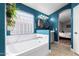 Bright blue bathroom with luxurious soaking tub and double mirrors at 18001 N 44Th Way, Phoenix, AZ 85032