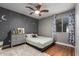 Charming bedroom featuring hardwood floors, a ceiling fan, and whimsical star accents at 18001 N 44Th Way, Phoenix, AZ 85032