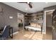 Versatile bonus room with travertine tile, a daybed, and built-in shelving at 18001 N 44Th Way, Phoenix, AZ 85032