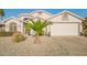 Charming single-story home boasts a well-maintained front yard with desert landscaping and a two-car garage at 18001 N 44Th Way, Phoenix, AZ 85032