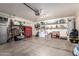 Spacious garage with ample storage shelves, tool chests, and room for multiple vehicles at 18001 N 44Th Way, Phoenix, AZ 85032