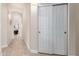 Bright hallway featuring arched doorways and sliding closet doors at 18001 N 44Th Way, Phoenix, AZ 85032