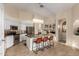 Bright kitchen with a central island, stylish lighting, stainless appliances, and ample cabinet space at 18001 N 44Th Way, Phoenix, AZ 85032