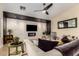 Beautiful living room with a decorative stone wall, fireplace, and comfortable seating area at 18001 N 44Th Way, Phoenix, AZ 85032