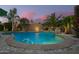 Stunning pool with elegant water features and lush landscaping, creating a serene backyard oasis at 18001 N 44Th Way, Phoenix, AZ 85032