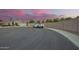 View of the property's surroundings, including a quiet street and well-maintained landscaping at 18001 N 44Th Way, Phoenix, AZ 85032