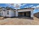 New home being built with a two-car garage, ready for customization at 18271 W La Senda Dr, Surprise, AZ 85387