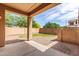 Covered patio overlooking a low-maintenance backyard with gravel and a patch of grass at 1843 S Sunnyvale Ave, Gilbert, AZ 85295