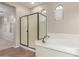 Modern bathroom with large tub, shower and window at 1843 S Sunnyvale Ave, Gilbert, AZ 85295