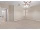 Neutral bedroom with ceiling fan and a doorway to walk-in closet at 1843 S Sunnyvale Ave, Gilbert, AZ 85295