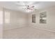 Spacious bedroom with neutral carpet and ceiling fan at 1843 S Sunnyvale Ave, Gilbert, AZ 85295