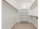 Walk-in closet with shelving and bars for hanging clothes at 1843 S Sunnyvale Ave, Gilbert, AZ 85295