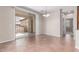 Open dining area featuring tile flooring and sliding glass doors to the patio at 1843 S Sunnyvale Ave, Gilbert, AZ 85295