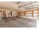 Spacious garage with shelving, ample storage space and a garage door with an automatic opener at 1843 S Sunnyvale Ave, Gilbert, AZ 85295