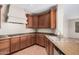 Spacious kitchen featuring granite countertops, wood cabinets, gas cooktop, and stainless steel appliances at 1843 S Sunnyvale Ave, Gilbert, AZ 85295