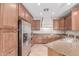 Updated kitchen with stainless steel appliances and granite countertops at 1843 S Sunnyvale Ave, Gilbert, AZ 85295