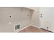Laundry room with tile floor, white door, electrical outlets, hookups for washer and dryer and shelving at 1843 S Sunnyvale Ave, Gilbert, AZ 85295