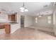 Open living space with hardwood cabinets, tile floors, and plush carpeting at 1843 S Sunnyvale Ave, Gilbert, AZ 85295