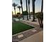 Community pool area with well-maintained landscaping and palm trees at 1843 S Sunnyvale Ave, Gilbert, AZ 85295