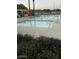 Sparkling community pool with ample lounge seating and clear blue water at 1843 S Sunnyvale Ave, Gilbert, AZ 85295
