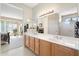 Bathroom featuring double sinks and a view of the bedroom and closet at 19005 N Diamante Dr, Surprise, AZ 85387