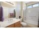 Clean bathroom featuring tile floors, vanity with sink, a large mirror, and a shower-tub combo at 19005 N Diamante Dr, Surprise, AZ 85387
