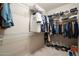Walk-in closet featuring ample shelving and organizational space for clothes and accessories at 19005 N Diamante Dr, Surprise, AZ 85387