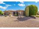 Charming single-story home featuring low-maintenance desert landscaping and a two-car garage at 19005 N Diamante Dr, Surprise, AZ 85387
