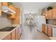 The kitchen features light wood cabinetry, tiled floor, and views to the breakfast nook at 19005 N Diamante Dr, Surprise, AZ 85387