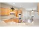 The eat-in kitchen has light wood cabinetry and views to the breakfast nook at 19005 N Diamante Dr, Surprise, AZ 85387