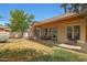 Expansive backyard and covered patio with sliding glass doors provide great indoor-outdoor flow at 20627 W Grandview Dr, Buckeye, AZ 85396